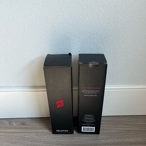 2 Peloton glass water bottle with protective sleeve